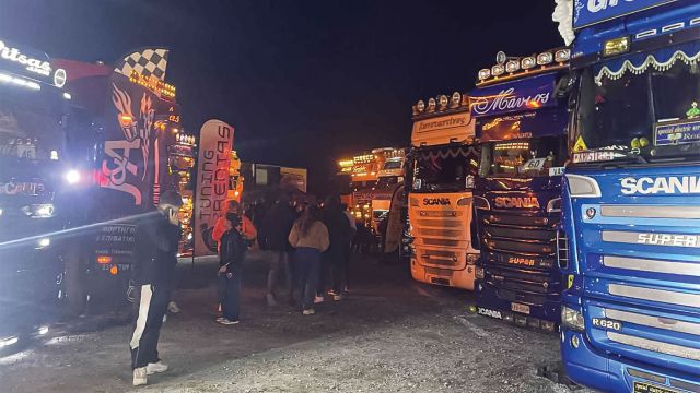 Axos trucks by night. 